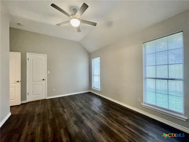 1715 Ramona Cir, San Marcos, TX 78666 - empty room featuring ceiling fan, dark wood-style flooring, vaulted ceiling, and a smoke detector