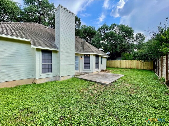 1715 Ramona Cir, San Marcos, TX 78666 - rear view of property with a patio area, a chimney, and a fenced backyard