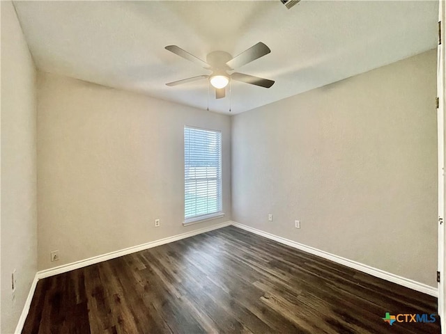 1715 Ramona Cir, San Marcos, TX 78666 - spare room featuring a ceiling fan and dark wood-style flooring