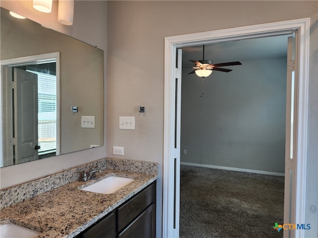 bathroom featuring vanity and ceiling fan