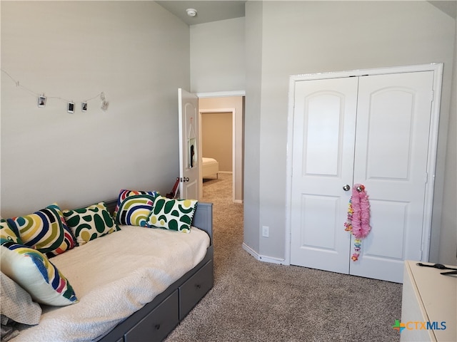 bedroom featuring a closet and carpet