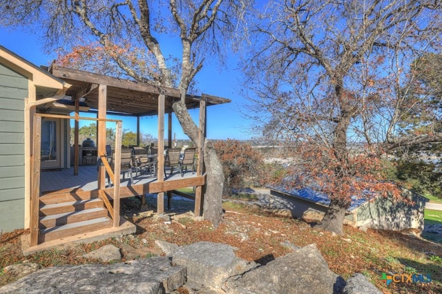 view of yard with a wooden deck