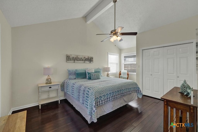 bedroom with vaulted ceiling with beams, a textured ceiling, dark hardwood / wood-style flooring, a closet, and ceiling fan