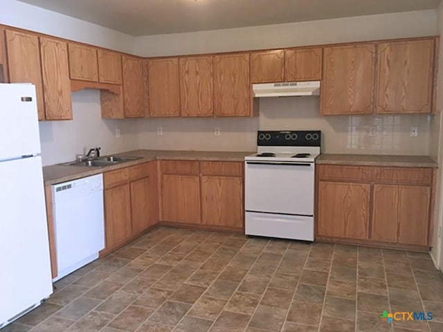 kitchen featuring white appliances and sink