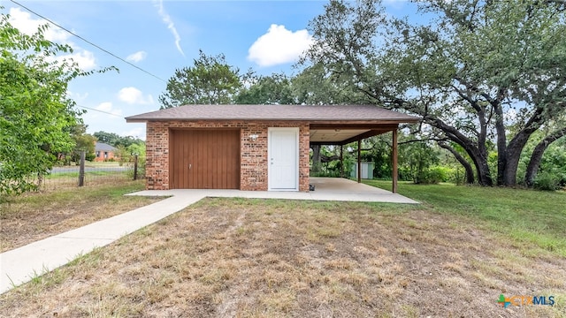 exterior space featuring an outdoor structure and a yard