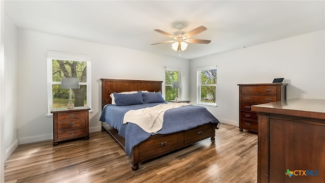 bedroom with hardwood / wood-style flooring and ceiling fan