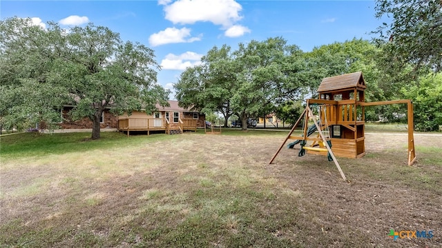 view of yard with a playground and a wooden deck