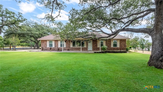 ranch-style house with a front yard