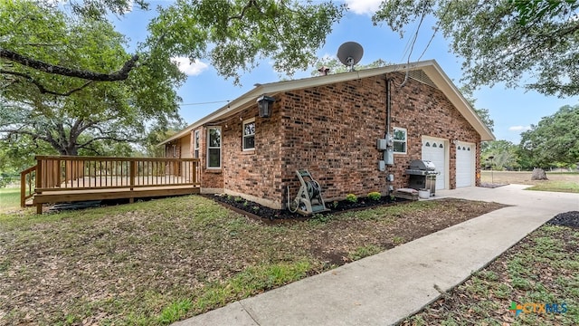 view of property exterior with a garage and a wooden deck