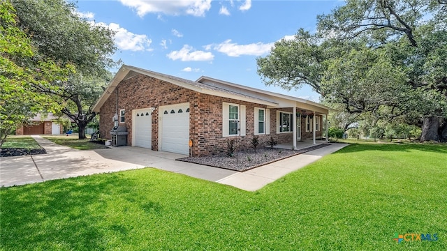 view of front of house with a garage and a front lawn