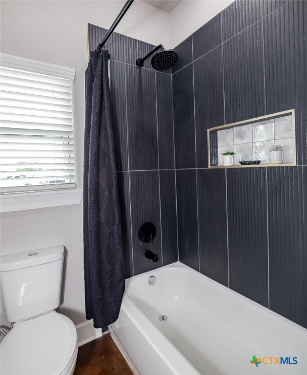 full bathroom with shower / tub combo and toilet