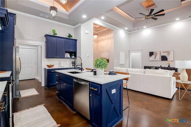 kitchen featuring blue cabinets, finished concrete flooring, a sink, appliances with stainless steel finishes, and a tray ceiling