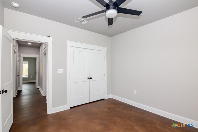 unfurnished bedroom with a closet and ceiling fan