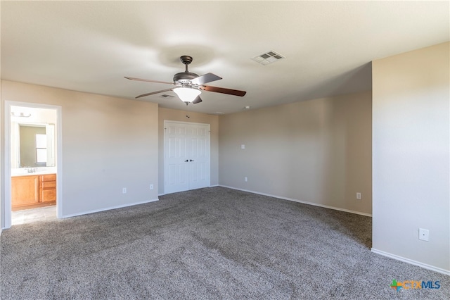 unfurnished room featuring carpet floors and ceiling fan