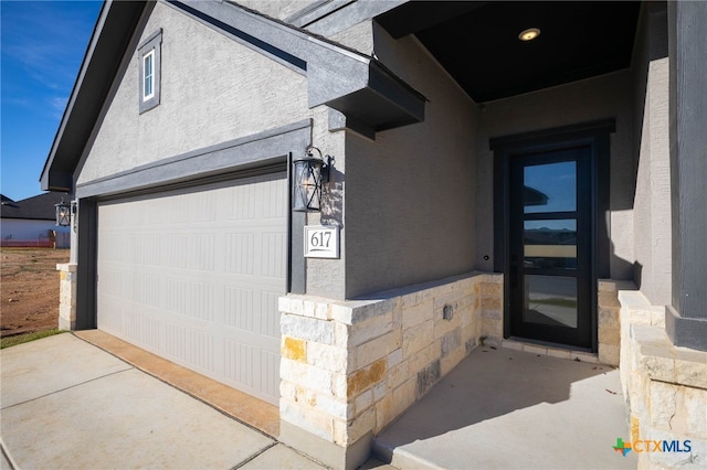 property entrance with a garage