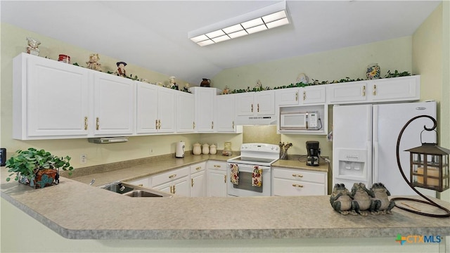 kitchen with white cabinets, lofted ceiling, white appliances, and sink