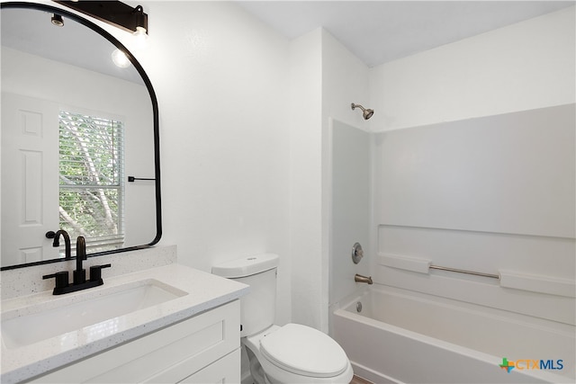 full bathroom featuring shower / washtub combination, vanity, and toilet