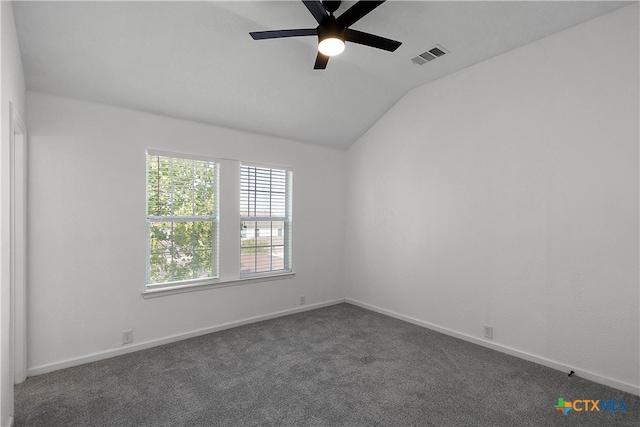 carpeted empty room with ceiling fan and lofted ceiling