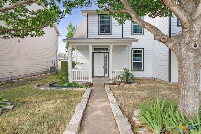 bungalow featuring a front lawn and covered porch