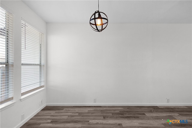 unfurnished room with dark hardwood / wood-style floors