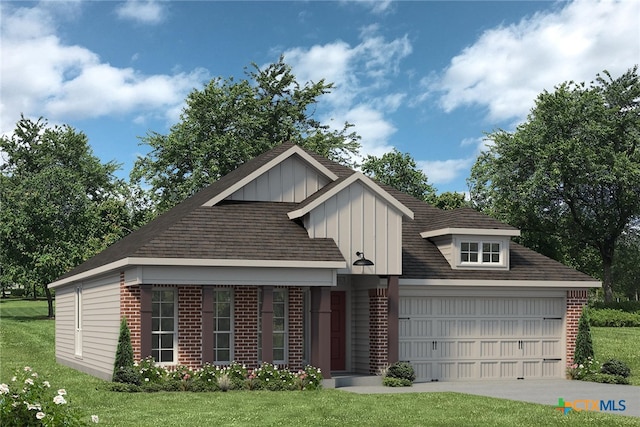 view of front of property with a garage and a front lawn