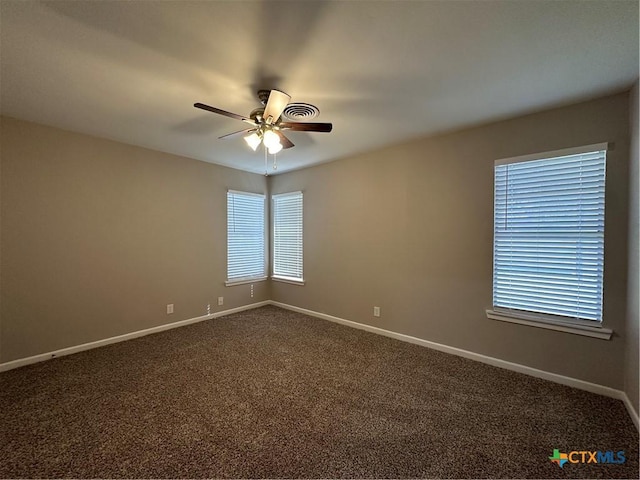 carpeted empty room featuring ceiling fan