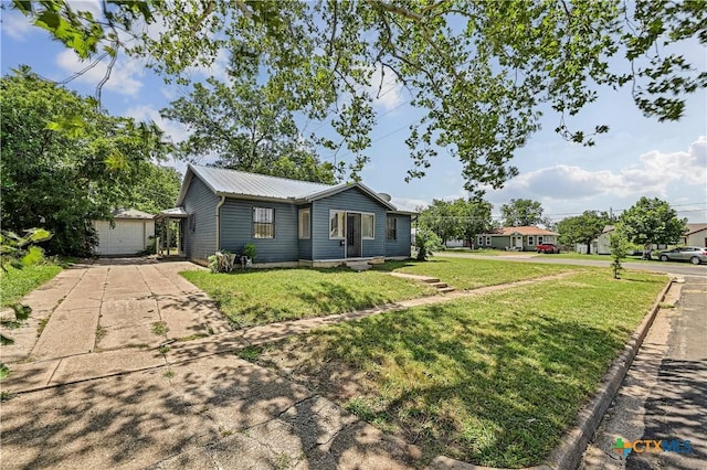 802 Cloud St, Killeen, TX 76541 - ranch-style house with a metal roof, a front yard, driveway, and an outdoor structure