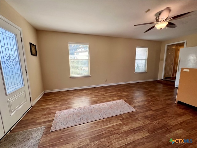 entrance foyer featuring ceiling fan and dark hardwood / wood-style floors