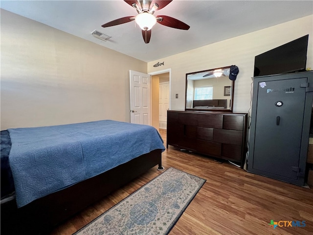 bedroom with ceiling fan and hardwood / wood-style floors