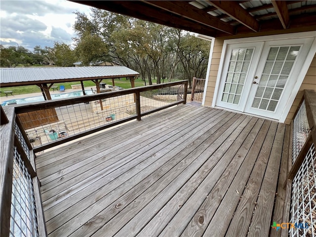 wooden deck featuring french doors