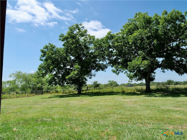 view of yard with a rural view