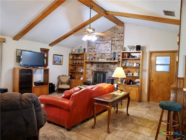 living room featuring a textured ceiling, a fireplace, vaulted ceiling with beams, and ceiling fan