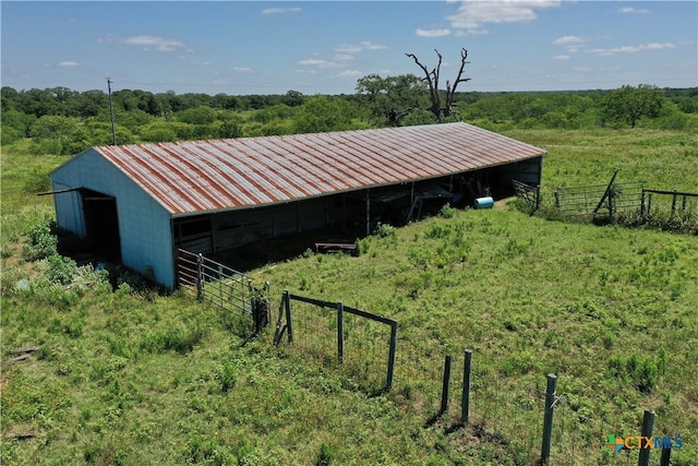 view of outbuilding with a rural view
