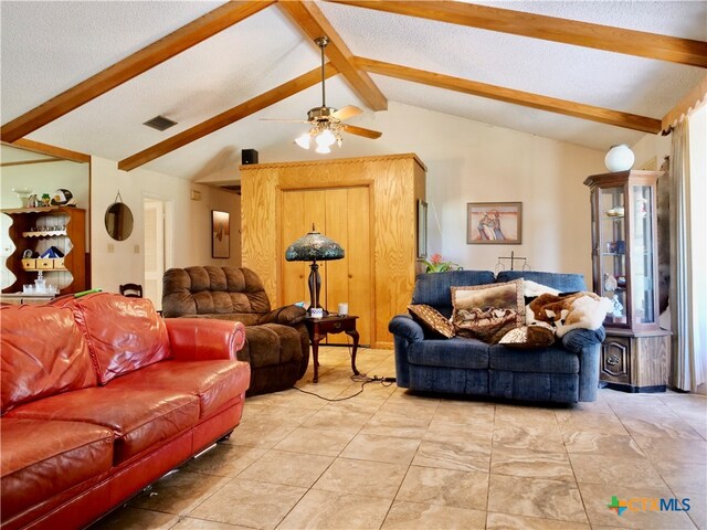 living room with ceiling fan and lofted ceiling with beams