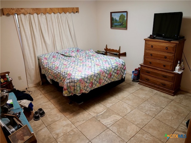 bedroom with light tile patterned flooring