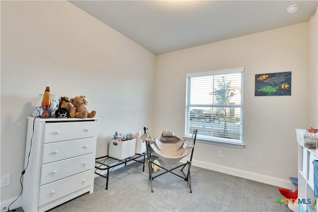 interior space with baseboards and a textured ceiling