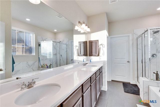 full bath featuring a stall shower, a sink, a bath, and double vanity