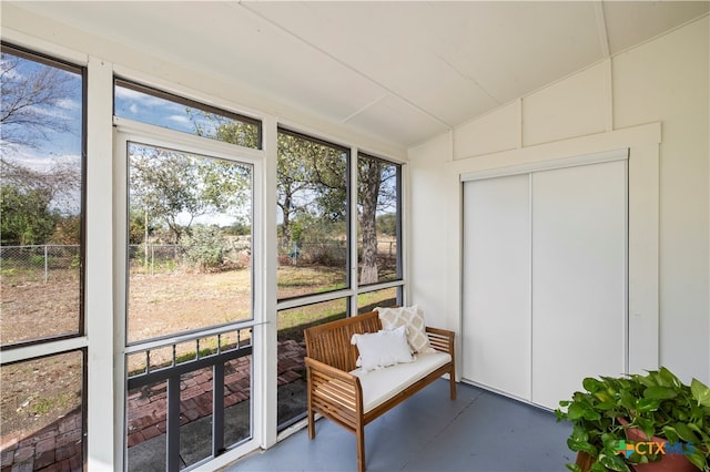 sunroom / solarium featuring vaulted ceiling