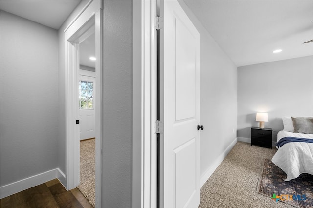 bedroom with dark hardwood / wood-style flooring