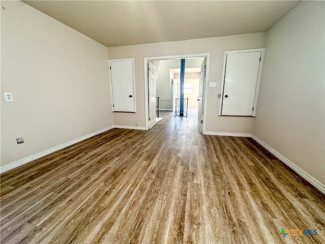 spare room featuring hardwood / wood-style flooring