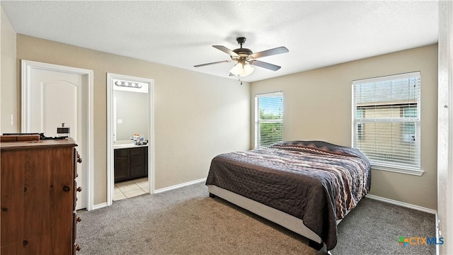 957/959 Floating Star, New Braunfels, TX 78130 - bedroom featuring light colored carpet, ensuite bath, and ceiling fan