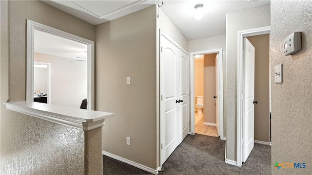 957/959 Floating Star, New Braunfels, TX 78130 - corridor featuring dark carpet and baseboards