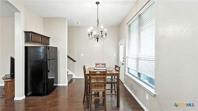 957/959 Floating Star, New Braunfels, TX 78130 - dining space with wood finish floors, a chandelier, and stairway