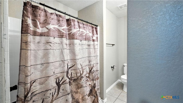 957/959 Floating Star, New Braunfels, TX 78130 - full bath with a textured wall, tile patterned flooring, and curtained shower
