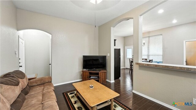 957/959 Floating Star, New Braunfels, TX 78130 - living area featuring arched walkways, dark wood-style floors, ceiling fan, and recessed lighting