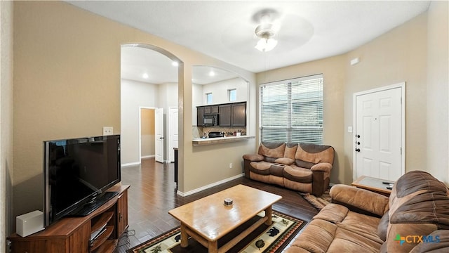 957/959 Floating Star, New Braunfels, TX 78130 - living room with arched walkways, dark wood-style floors, and a ceiling fan