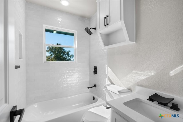 full bathroom featuring bathing tub / shower combination, vanity, and toilet