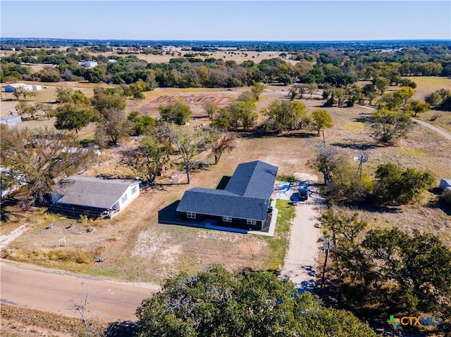 birds eye view of property featuring a rural view