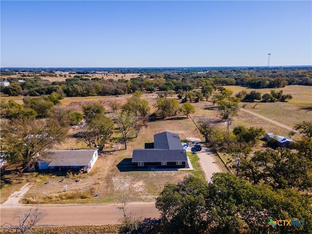 birds eye view of property with a rural view