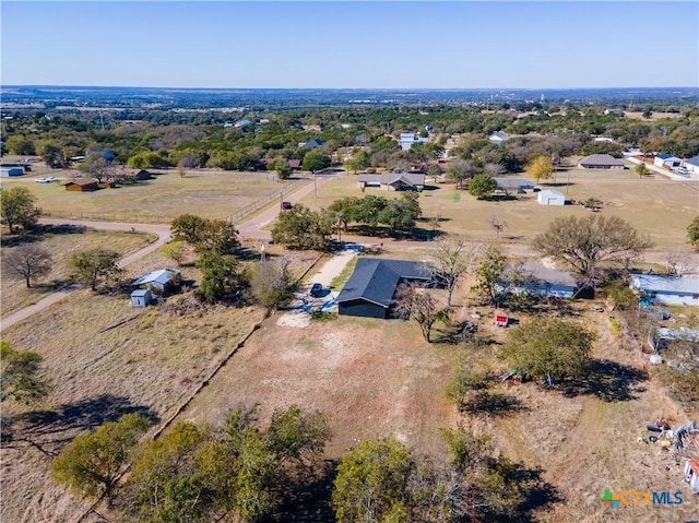 birds eye view of property featuring a rural view